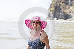 A beautiful mature senior woman on the beach