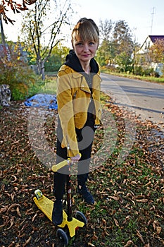 Beautiful mature woman on an autumn walk in the forest.