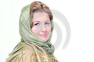 Beautiful mature woman in a headscarf