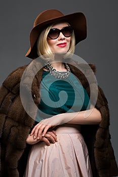 Beautiful mature woman in natural fur coat
