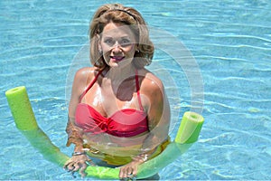 Beautiful Mature Woman in the Swimming Pool