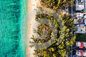 Beautiful Mauritius island with beach Flic en flac. Coral reef around tropical palm beach, Flic en Flac, Mauritius. Aerial view of photo