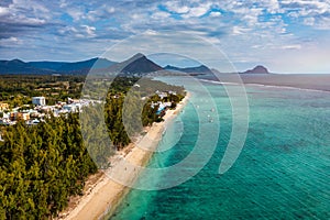 Beautiful Mauritius island with beach Flic en flac. Coral reef around tropical palm beach, Flic en Flac, Mauritius. Aerial view of photo