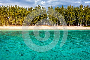 Beautiful Mauritius island with beach Flic en flac. Coral reef around tropical palm beach, Flic en Flac, Mauritius. Aerial view of photo