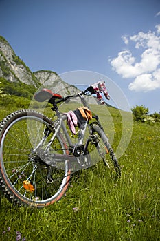 Beautiful meadow with bicycle and socks