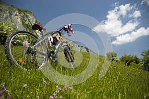 Beautiful meadow with bicycle and socks