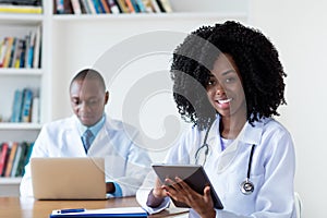 Beautiful medical student with general practitioner