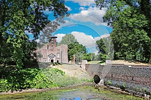 Beautiful medieval brick stone castle ruin, bridge over water moat - Kasteel Bleijenbeek, Afferden, Netherlands