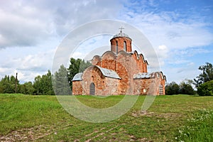 Beautiful medieval church of the Savior on Kovalevo with red walls near Velikiy Great Novgorod, Russia