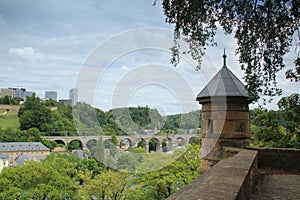 Beautiful medieval houses, a monastery, a stone bridge over the river, a top view of the city of Luxembourg, an old fortress,