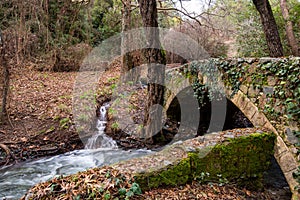 Beautiful medieval stoned bridge with river flowing