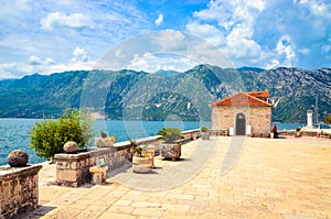 Beautiful mediterranean landscape. Our Lady of the Rock Island near town Perast, Kotor bay, Montenegro