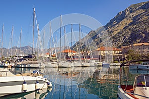 Beautiful Mediterranean landscape. Sailboats in port near Old Town of Kotor. Montenegro