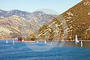 Beautiful Mediterranean landscape with sailboats on the water. Sunny summer day. Montenegro. View of the Bay of Kotor