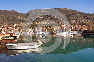 Beautiful Mediterranean landscape with small harbor for fishing boats.  Montenegro, Tivat city. View of Marina Kalimanj