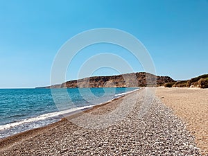 Beautiful Mediterranean landscape. View of empty wild beach and clear turquoise water of Mediterranean sea. Cyprus.