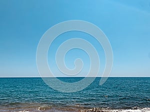 Beautiful Mediterranean landscape. View of empty wild beach and clear turquoise water of Mediterranean sea. Cyprus.