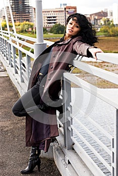 Beautiful melancholic woman on the bridge