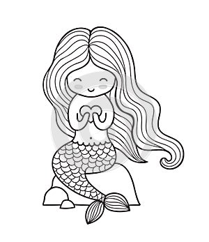 Beautiful mermaid with long hair, sitting ona a rock.