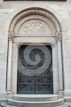 The beautiful metal door of Grossmunster , holy cathedral of Zurich, background