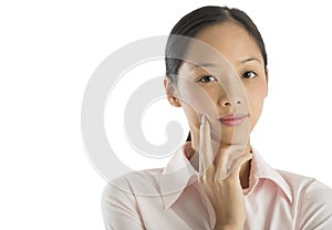 Beautiful Mid Adult Businesswoman With Finger On Cheek