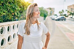 Beautiful middle age hispanic woman smiling happy outdoors