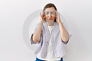 Beautiful middle age hispanic woman standing over isolated background showing middle finger, impolite and rude fuck off expression