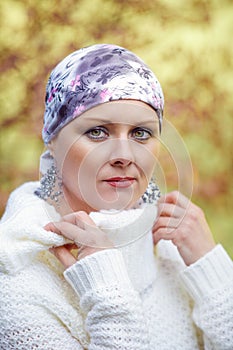 Beautiful middle age woman cancer patient wearing headscarf