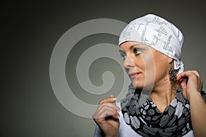 Beautiful middle age woman cancer patient wearing headscarf