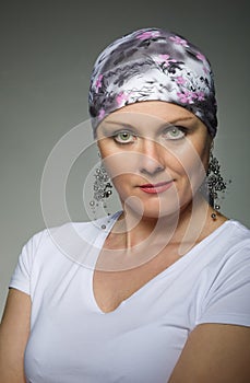 Beautiful middle age woman cancer patient wearing headscarf