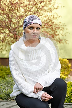 Beautiful middle age woman cancer patient wearing headscarf