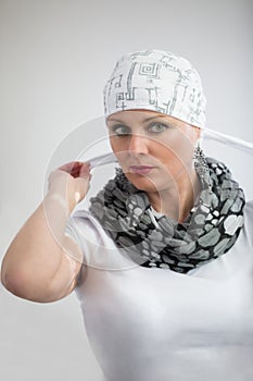 Beautiful middle age woman cancer patient wearing headscarf