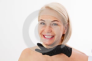 Beautiful middle-aged woman close up before plastic surgery and injection of botox isolated over white photo