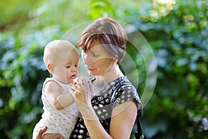 Beautiful middle aged woman and her adorable little grandson