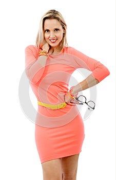Beautiful middle aged woman in short pink dress