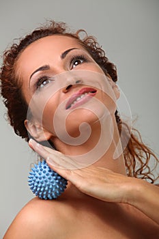 Beautiful middleaged woman massages herself