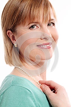 Beautiful middleaged woman on a white background