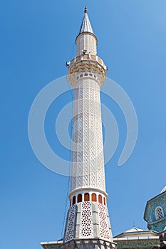 A beautiful minaret towards the blue sky. Canakkale-Turkey