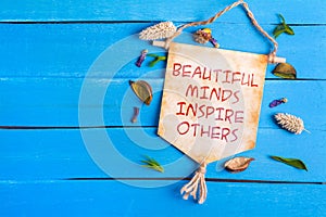 Beautiful minds inspire others text on Paper Scroll