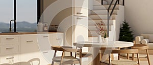 A beautiful minimal dining table in a minimal white Scandinavian kitchen design