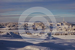 Beautiful minimalistic landscape of the hillside covered with white snow