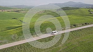 Beautiful and miraculous colors of green spring panorama landscape of Tuscany, Italy. Sunny morning near Pienza. Aerial view.