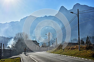 Beautiful misty landscape in well known Busteni mountain resort with Caraiman mountains in the background, Prahova Valley, Romania