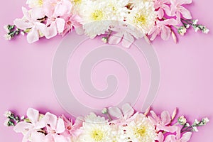 Beautiful mix flowers frame on soft pink romance background