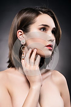 Beautiful mixed asian-caucasian race girl wearing earrings