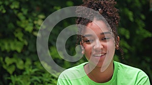 Beautiful mixed race African American girl teenager young woman looking sad then smiling and happy