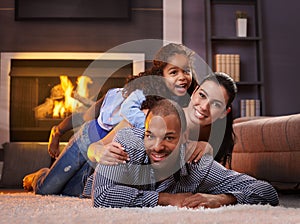 Beautiful mixed race family at home smiling photo