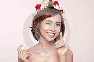 Beautiful model applying cosmetic cream treatment on her face on