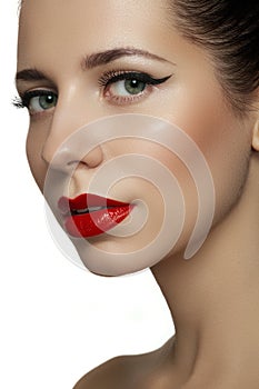 Beautiful model with bright red retro lips make-up