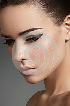 Beautiful model face with fashion eyeliner make-up